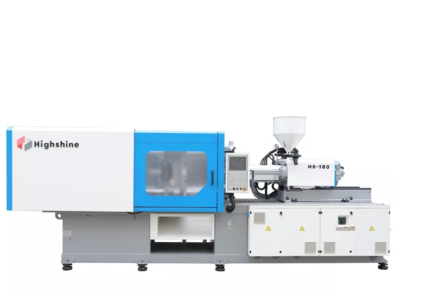 Injection molding machine on a white background