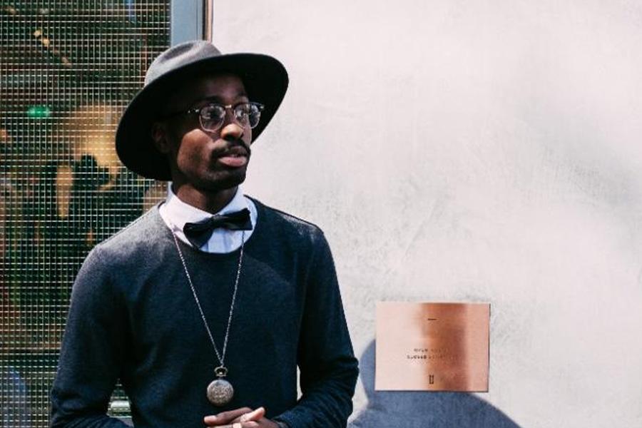 man in black fedora hat