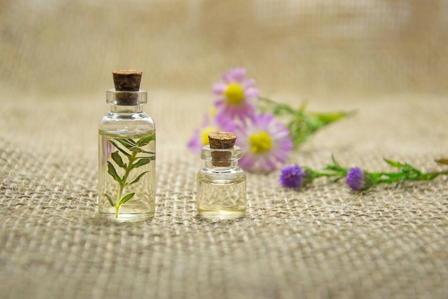 Transparent vial containing essential oil