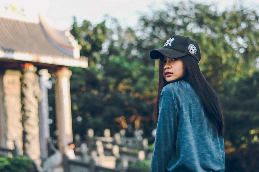 Woman rocking a black organic cotton cap