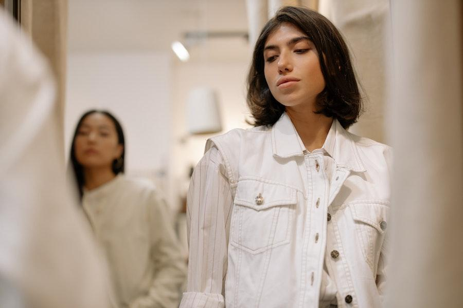 Woman wearing a white utility vest