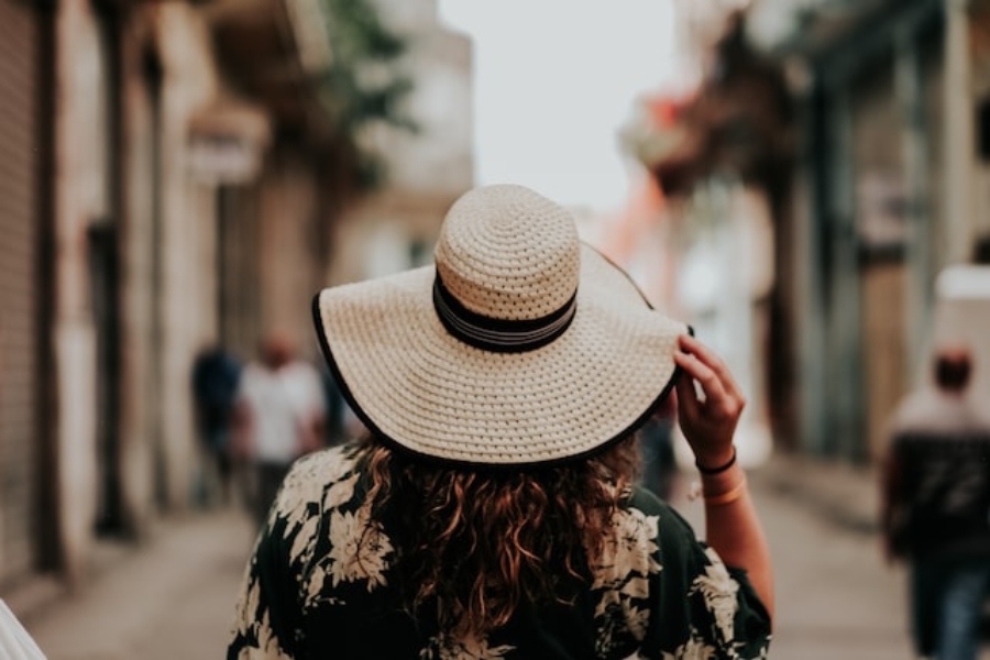 A woman wearing a straw sun hat