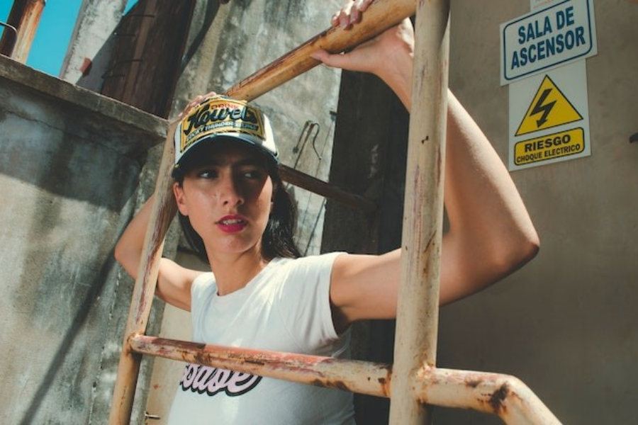 A woman wearing a trucker hat