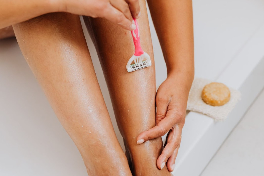 Woman using shaving products